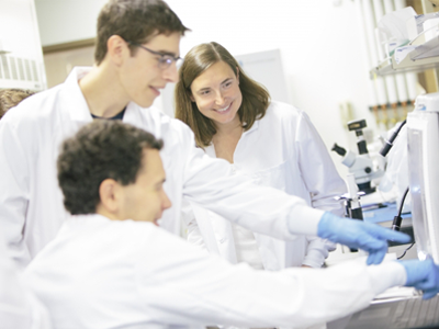 Anja Kunze, right, works with computer science and biochemistry students in her lab at Montana State University 